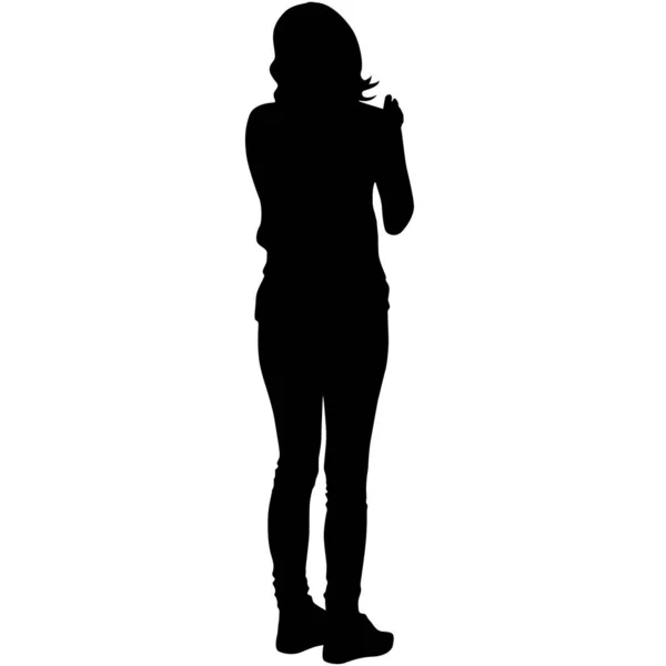 Silhouette stands girl on a white background — Stok Vektör