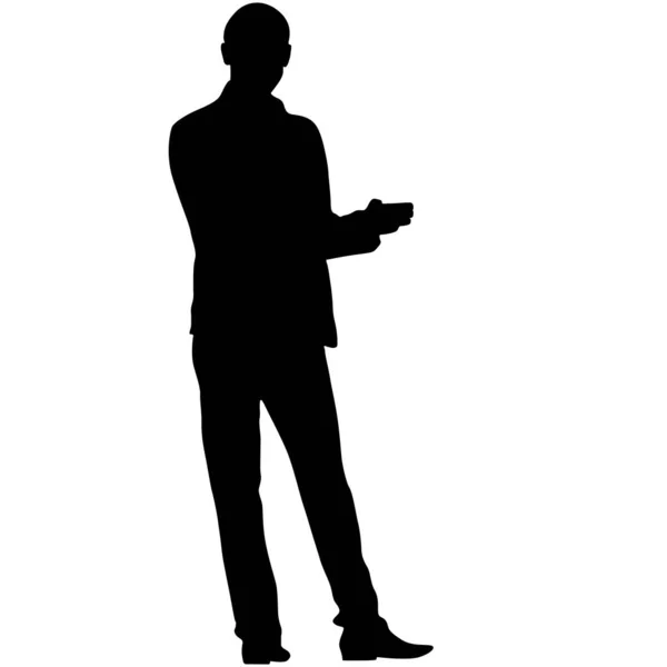 Een man staat met zijn handen in de voorkant, silhouet op een witte achtergrond — Stockvector
