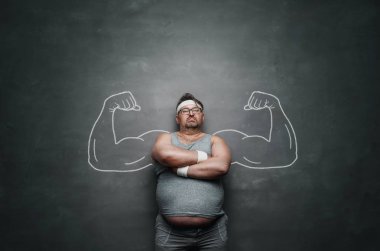 Funny sports nerd with huge muscle arms drawn on the gray background with copy space  clipart