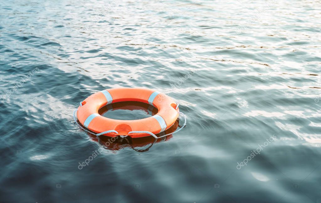 Life buoy floating on the water with copy space 