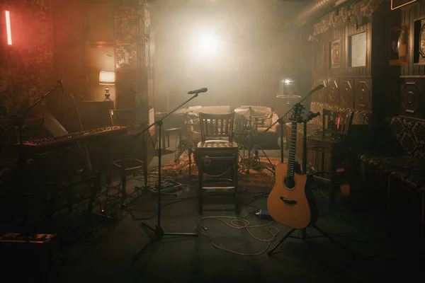 Empty stage of a small unplugged live music concert - Stock Image -  Everypixel