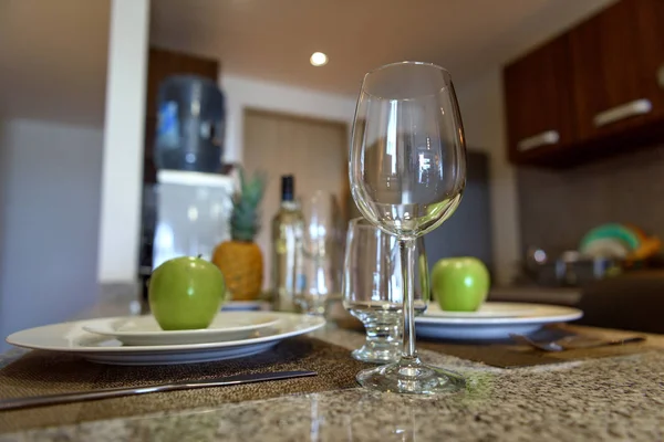 Wine glass on the table close-up. Cutlery in the background. Stock Photo
