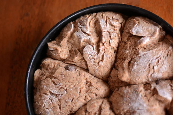 The dough on a tray on the table is ready for baking. — Stock Photo, Image