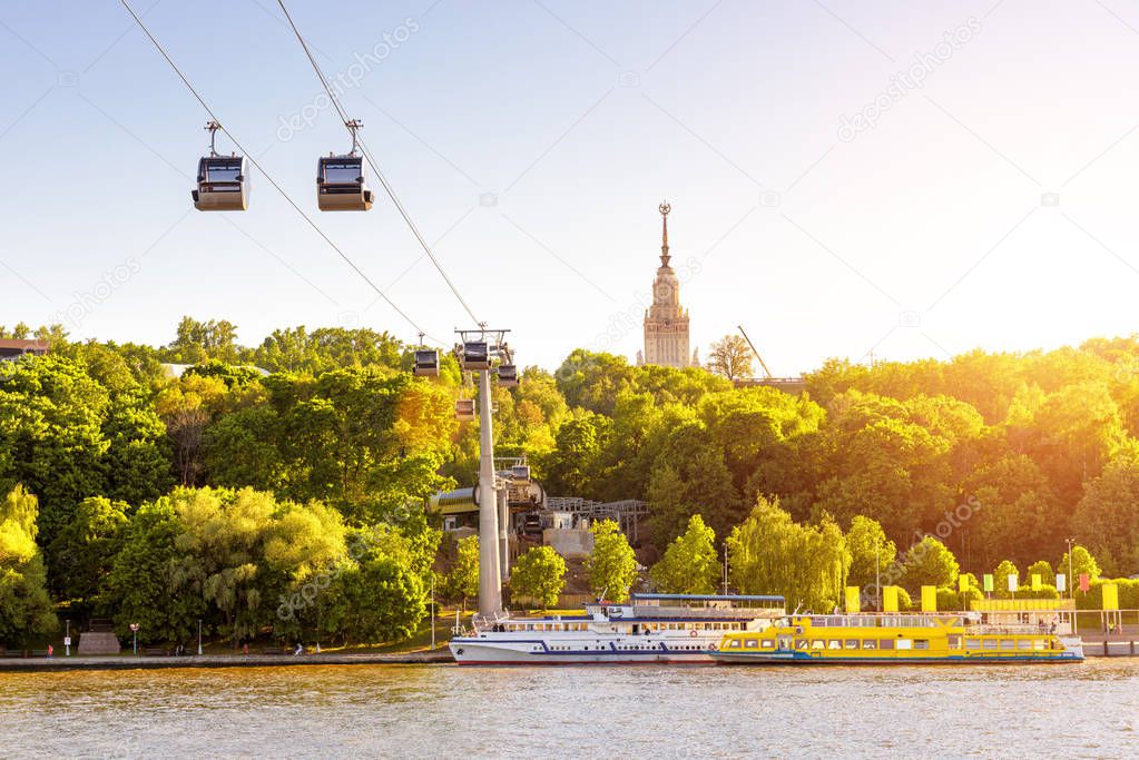 Beautiful panorama of Moscow in sun light, Russia. Scenic view of the cable car between Sparrow Hills and Luzhniki Stadium in Moscow. Cableway cabins hang over Moskva River at Moscow Luzhniki park.