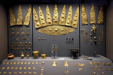 Athens - May 7, 2018: Gold jewelry from ancient Greek Mycenae. Golden crowns and other precious objects in the National Archaeological Museum in Athens, Greece. clipart