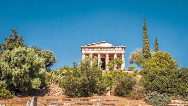 Temple of Hephaestus in the Agora, Athens, Greece. It is one of the main landmarks of Athens. Scenic panoramic view of the ancient Greek ruins in Athens center. Remains of antique Athens in summer.