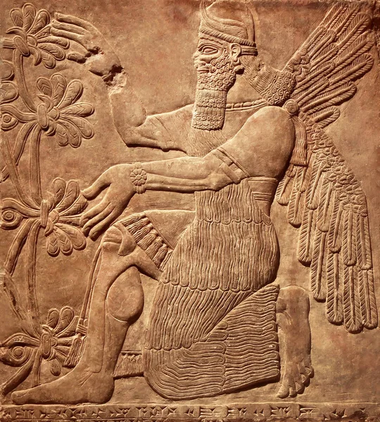 Assyrian wall relief of a winged genius