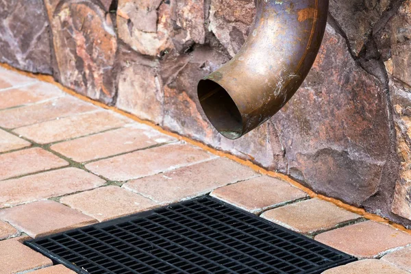 Gutter downspout on the wall of house — Stock Photo, Image