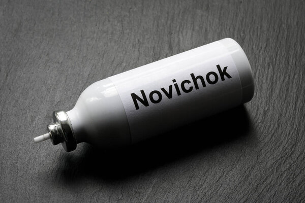 Novichok agent poison on dark background. Vial with deadly Novichok nerve venom close-up. Attack and poisoning concept.