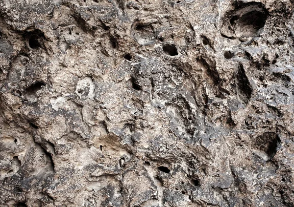 Primer plano de la pared de textura de piedra porosa marrón — Foto de Stock