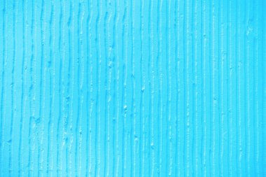 alçı dikey çizgiler ve çizgiler ile dokulu mavi arka plan