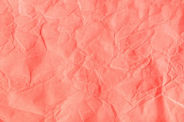 Zmačkaný oranžově růžový papír — Stock fotografie