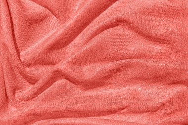 gümüş lurex iplik ile mercan renkli dökümlü kumaş