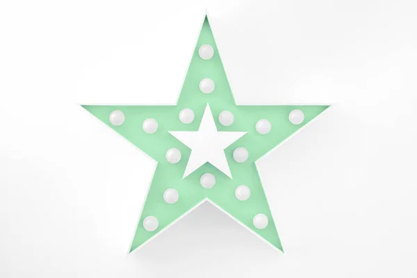 Mint decorative star with lots of lights on white background — Stock Photo, Image