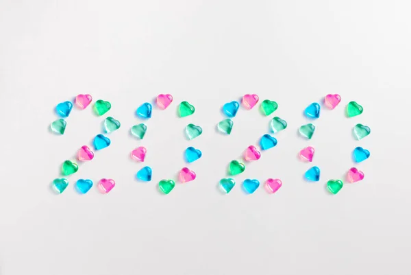 Symbol from number 2020 made of pastel colored decorative glass — Stock Photo, Image
