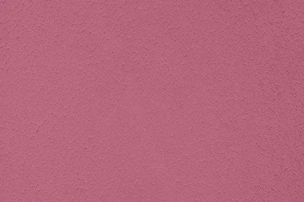 Темно-рожевий кольоровий низький контраст бетонний текстурований фон з — стокове фото