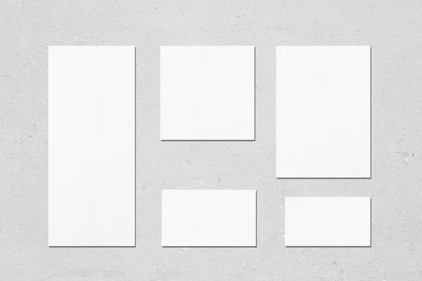 Empty white wedding stationery mockups on neutral light grey bac