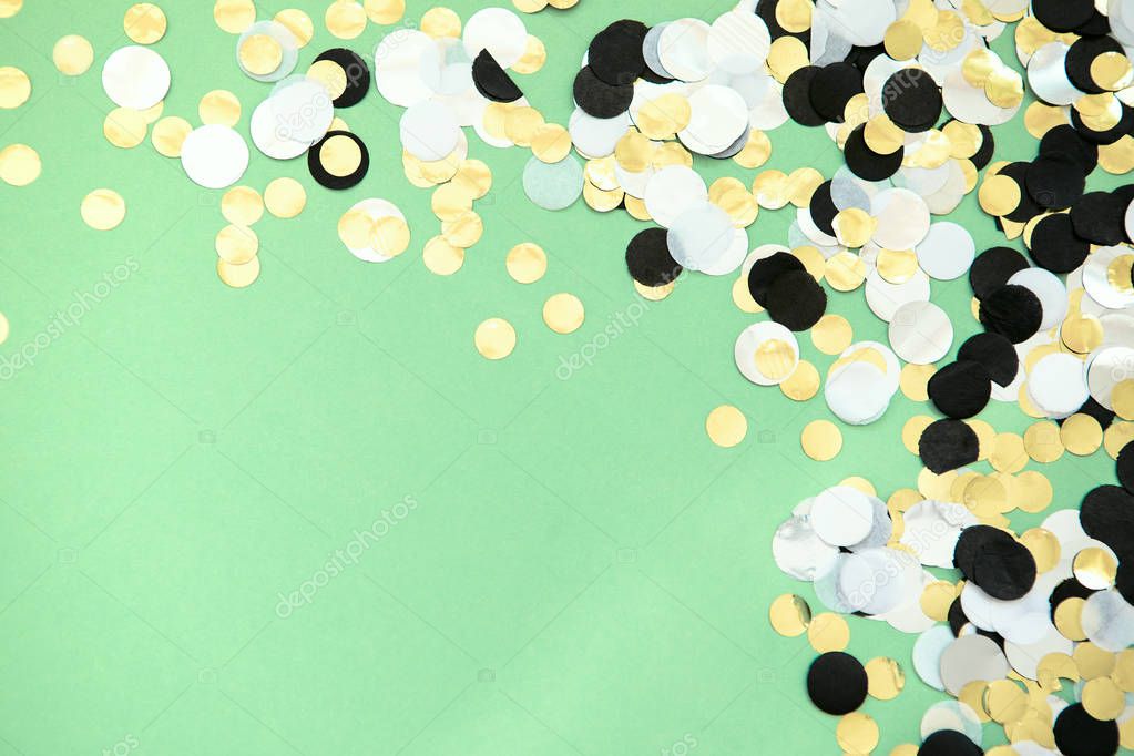 foil confetti sparse on trendy mint colored background