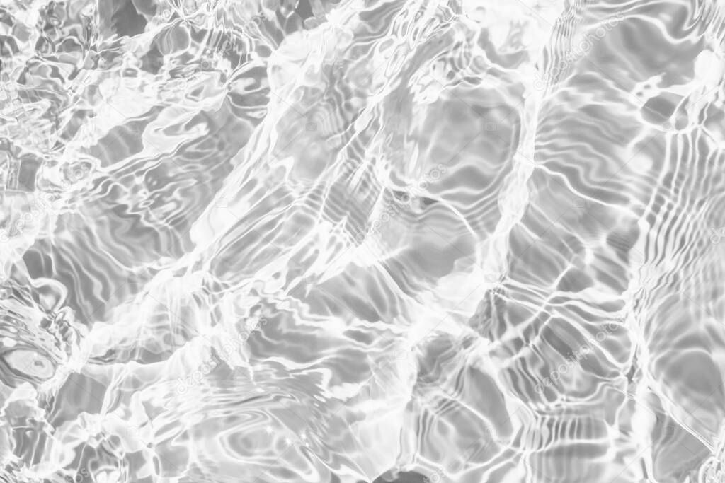Closeup of desaturated transparent clear rough water surface texture with splashes and bubbles. Trendy abstract nature background. 