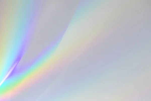 Texture leggera sfocata della rifrazione dell'arcobaleno sulla parete bianca — Foto Stock