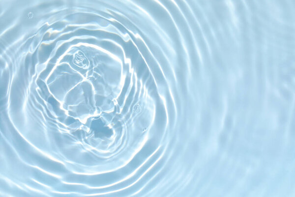 transparent blue colored clear calm water surface texture 