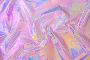Soyut Modern Pastel, 80 'ler tarzında pembe holografik arka plan. Buruşuk, yanardöner folyo, gerçek kumaş. Sentetik dalga. Buhar dalgası stili. Retrowave, retro futurism, webpunk