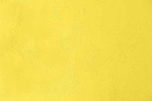 Gesättigte gelbe kontrastarme Betonstruktur Hintergrund — Stockfoto