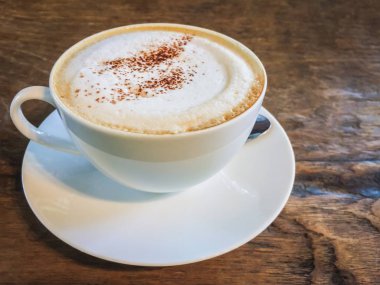 Cappuccino Kahve Kupası Olay yerinde ahşap masa içecek arka planlar