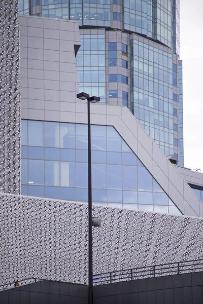 A fragment of the modern building with mirror glasses. Horizontally. Vertically.