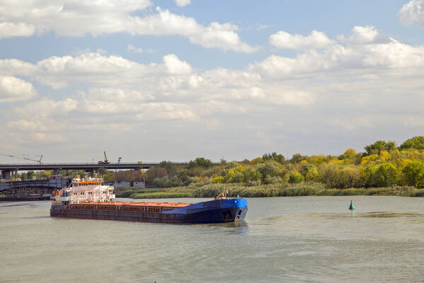  Oil tanker on the river. Horizontal.