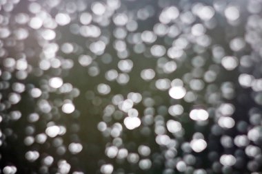 Gri ve renk bokeh soyut arka plan. siyah arka planda ışıklar bokeh