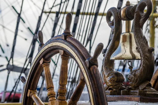 Ships Bell and wheel the old sailboat, close-up Royalty Free Stock Photos