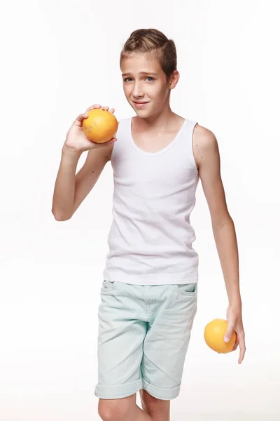 Young Guy White Shirt Holding Two Oranges White Background Studio — Stock Fotó