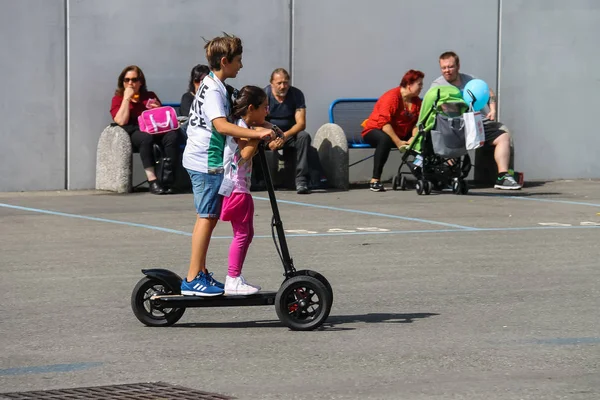 Parma Italy September 2016 Children Riding Electric Scooter People Resting Stock Image