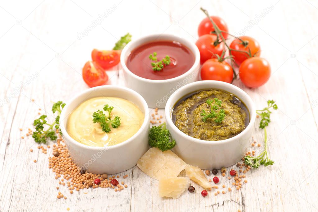 close-up photo of assorted sauces in bowls