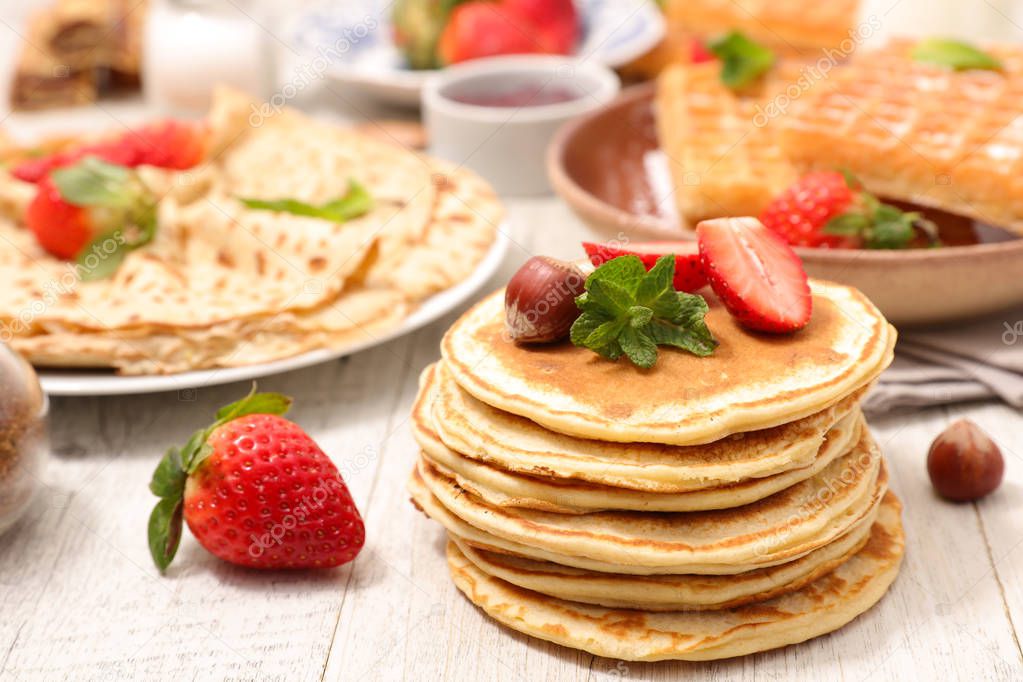 assorted pancakes, waffles and crepes
