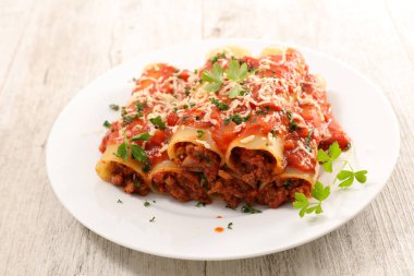 canneloni with beef and tomato sauce clipart