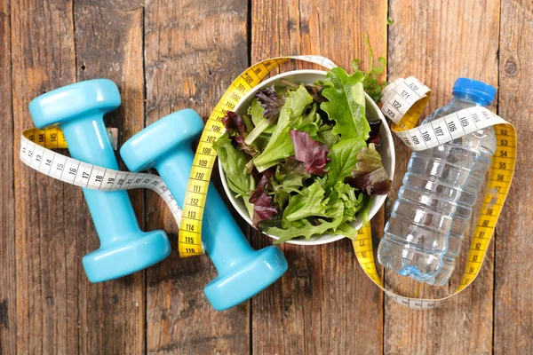 salad with water and dumbbell