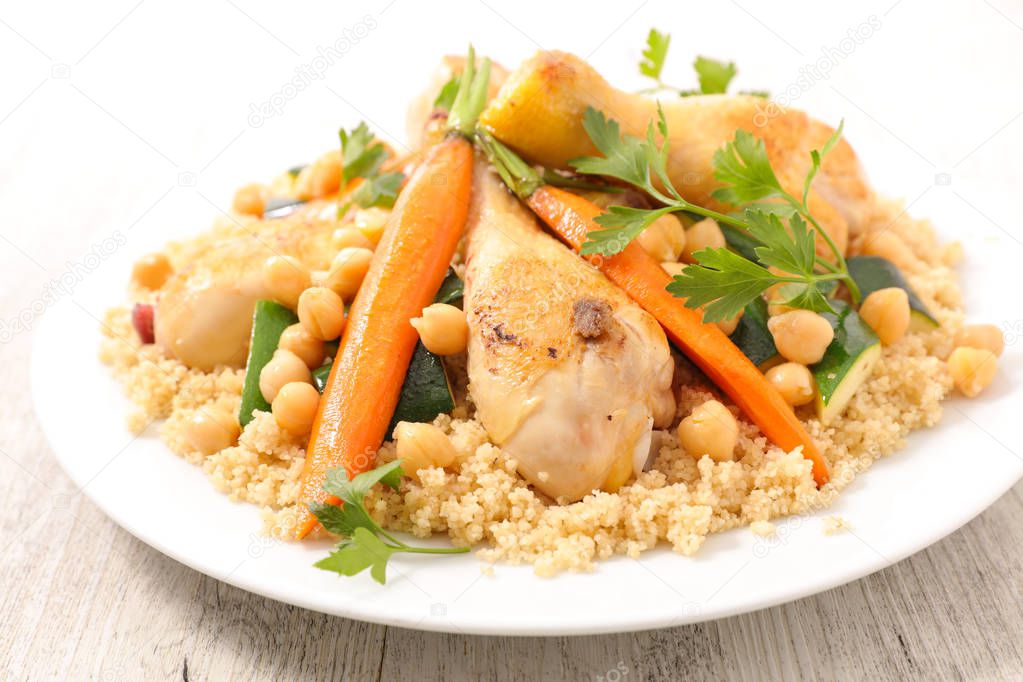 close-up photo of couscous with chicken and vegetable