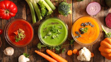 Top view of assorted vegetable soup in bowls 
