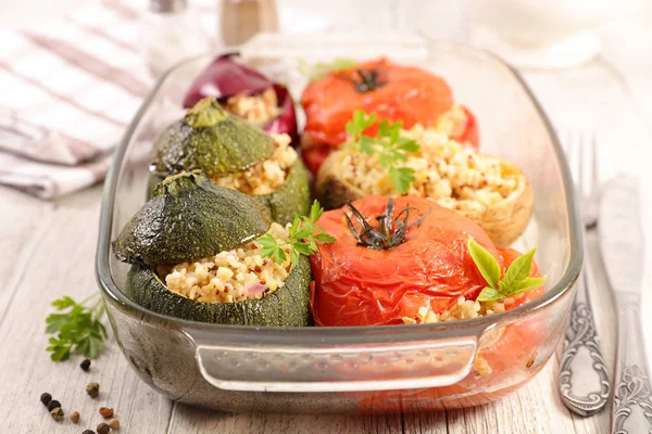 baked stuffed vegetables in glass bowl, diet cooking