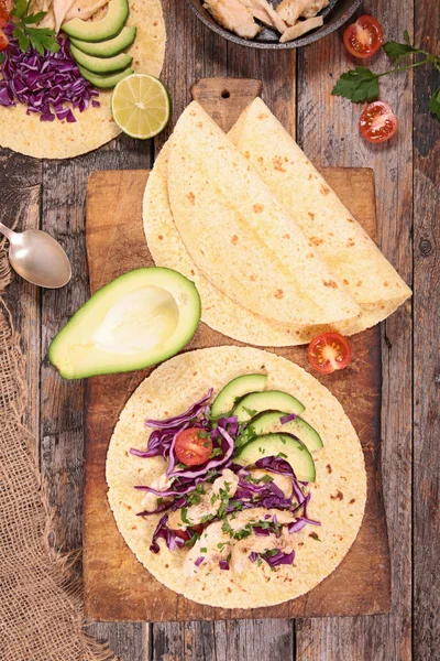 Taco with chicken and avocado