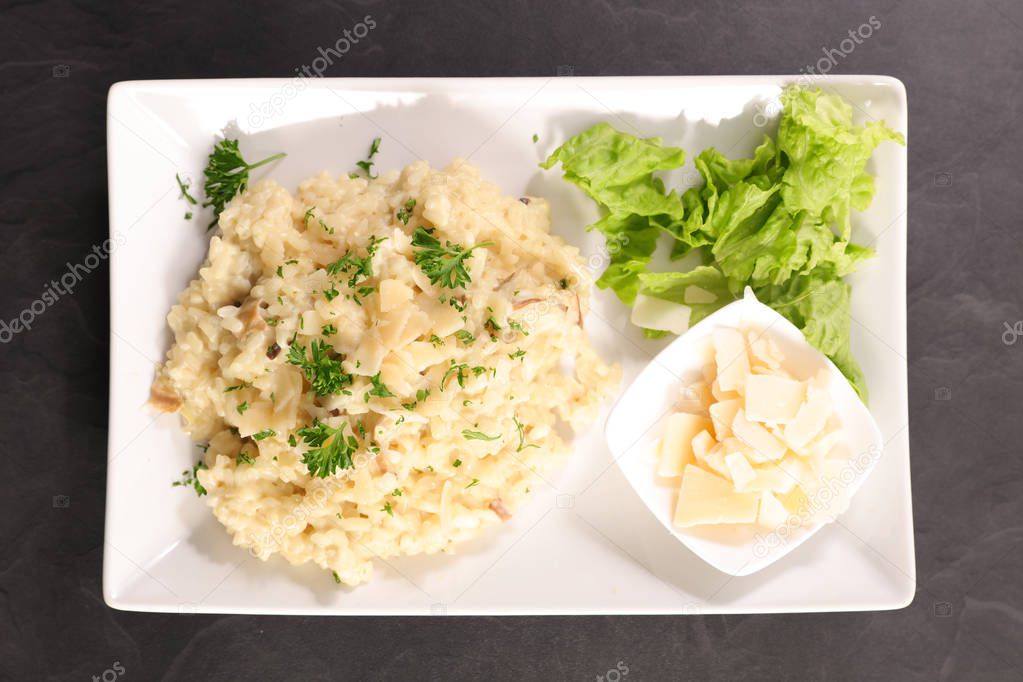 Mushroom risotto with parmesan cheese and creamy sauce