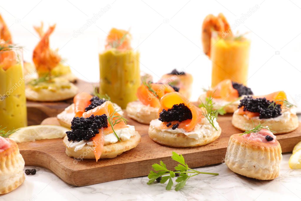 close up shot of delicious festive assorted finger food on table 