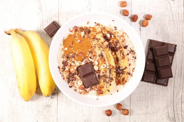 porridge with banana, nuts and chocolate