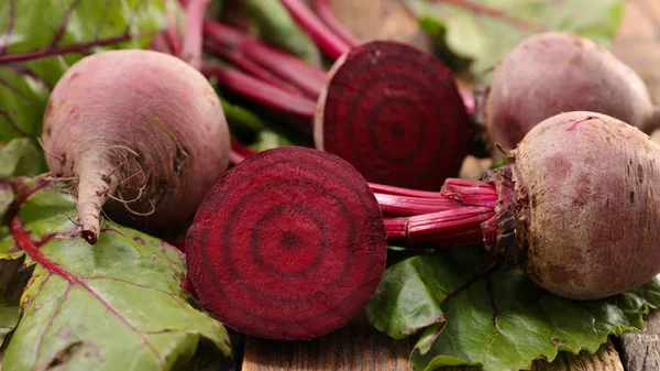 close-up view of fresh beetroots and leaves