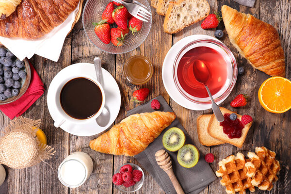 breakfast composition with coffee and desserts