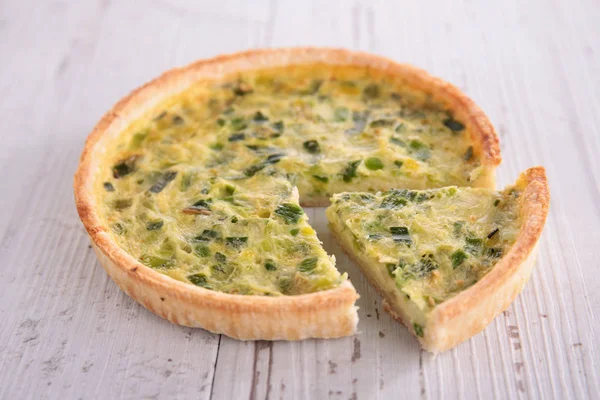 vegetable cake quiche on wooden table