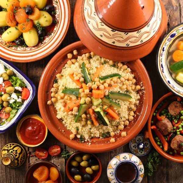 Arabic food assortment served on plates and bowls on table