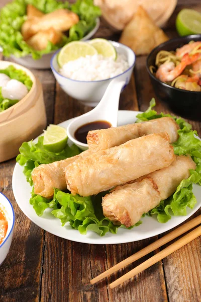 spring rolls, soy sauce and asian cuisine on table